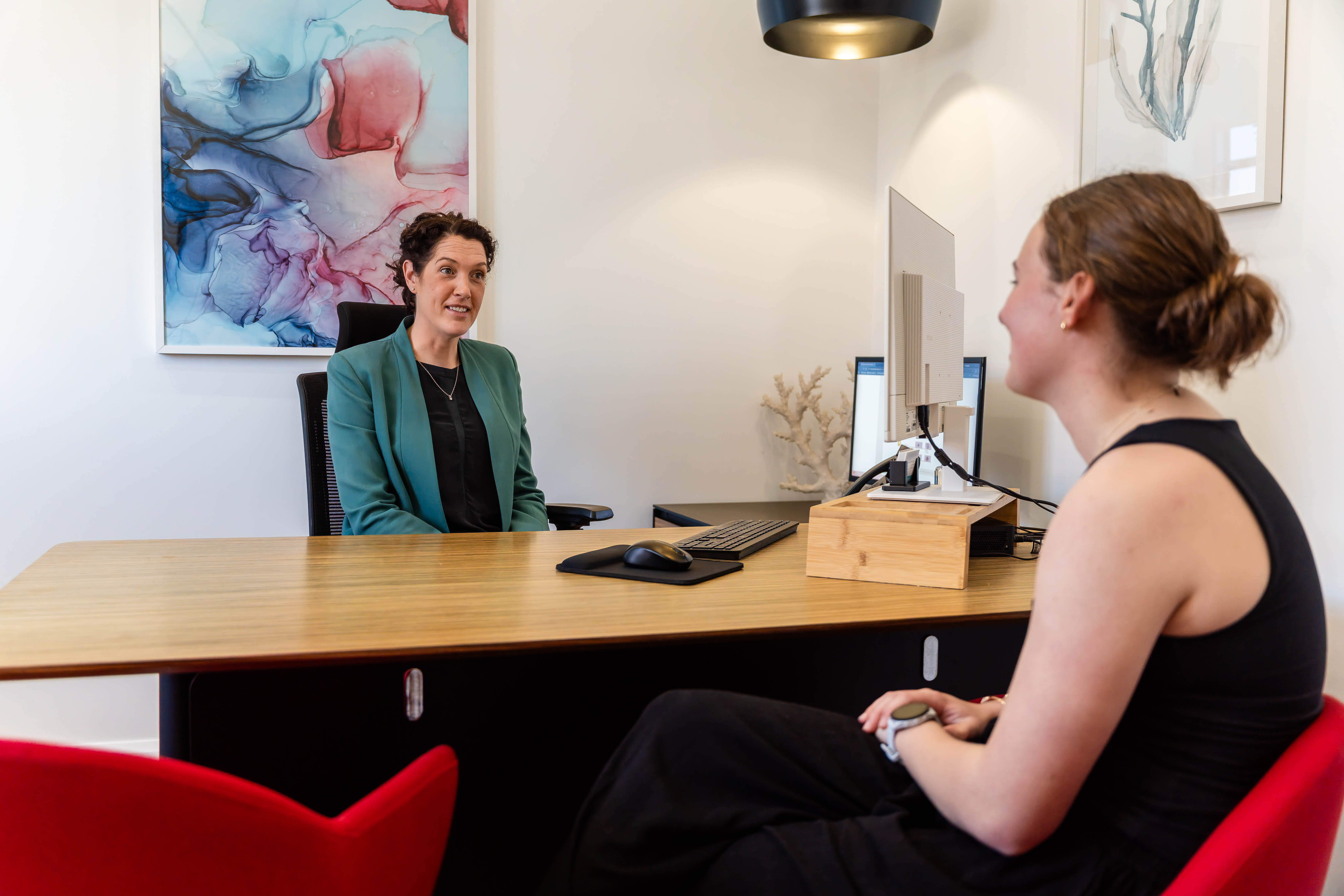 Dr Eliza Malkoun consulting with a patient
